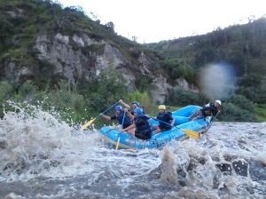 Kim, Lisa, Jarrod, and I, together with our trusty guide, paddle franticly as we travel through the rapids.