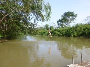 Kim swinging into the river.